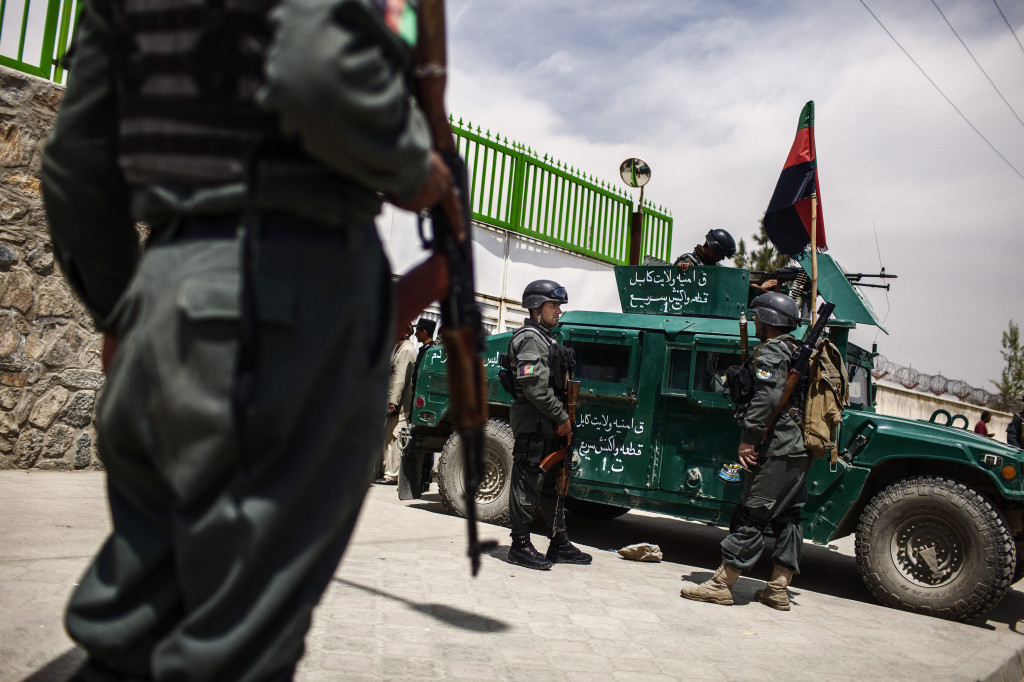 Afghan police standing outside the Cure International Hospital in Kabul after an Afghan police officer shot and killed three American doctors. It was the second apparently unprovoked attack on foreigners by Afghan police officers in recent weeks. On April 4, an officer shot and killed a photographer for The Associated Press, Anja Niedringhaus, and wounded a correspondent, Kathy Gannon. KABUL. AFGHANISTAN. Diego Ibarra Sanchez | The New York Times
