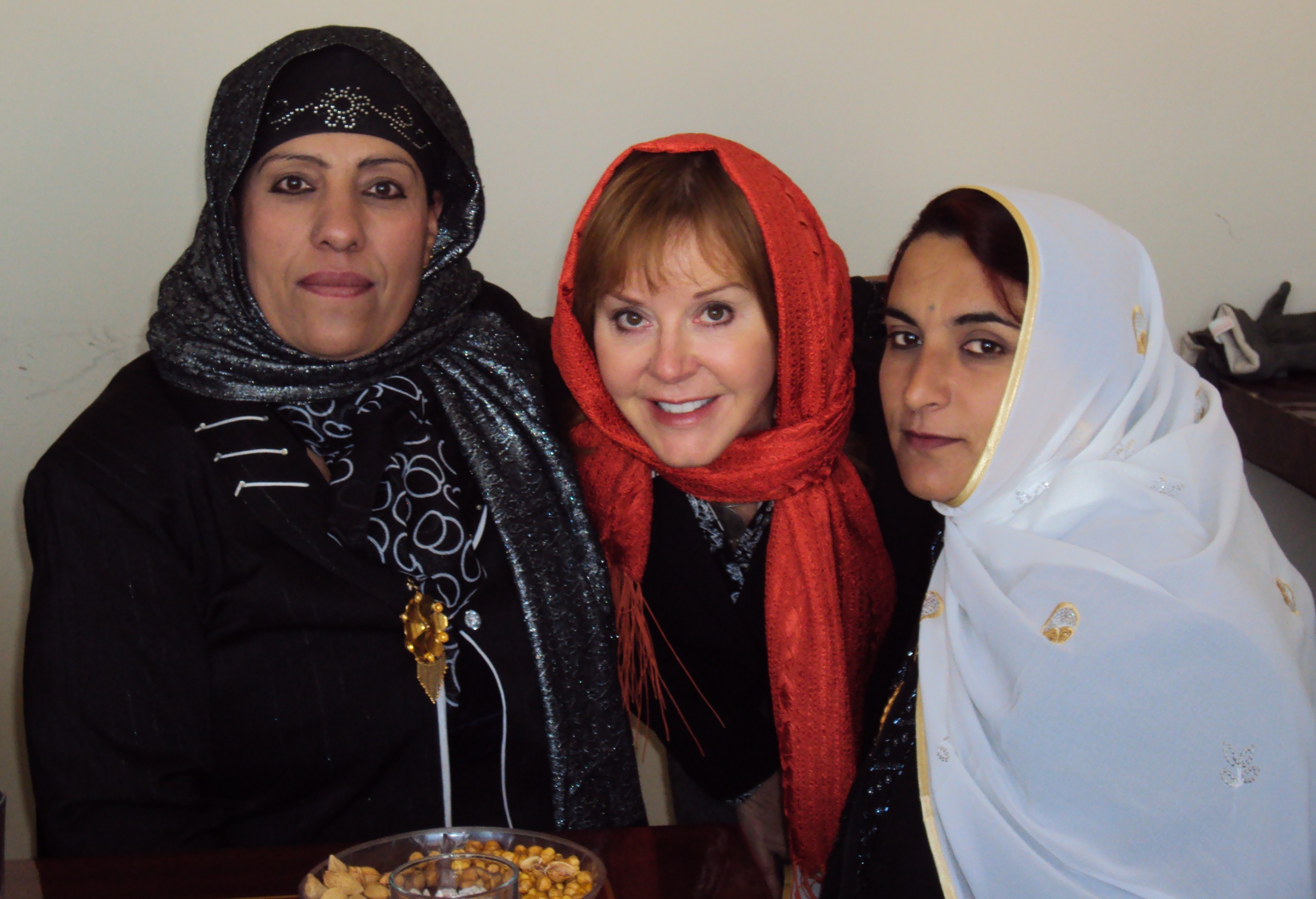 Deb Alexander describes the photo: "Two very strong women that I worked with over a year in Zabul province. Zabul is considered the badlands of Afghanistan. The place where gun and opium runners, warlords and Taliban cross paths and hide out. It's where I survived my worst attack. These two women were on the provincial council, one was a midwife, and both were from a nomad tribe called the Kucchi."