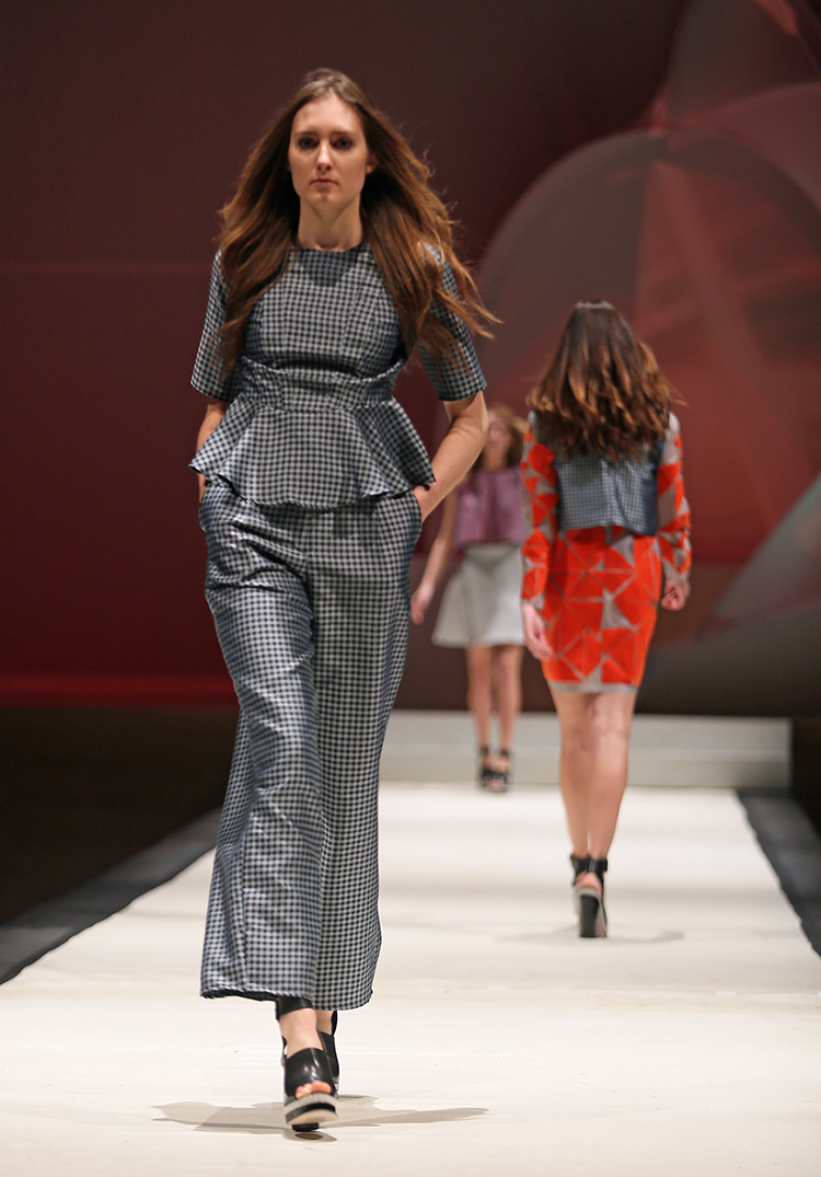 Syracuse University senior Miranda Bull designed an outfit shown at the SU Senior Collection Fashion Show at Goldstein Auditorium. The annual show presents the work of seniors in the College of Visual and Performing Arts fashion design program. Gloria Wright | Syracuse New Times