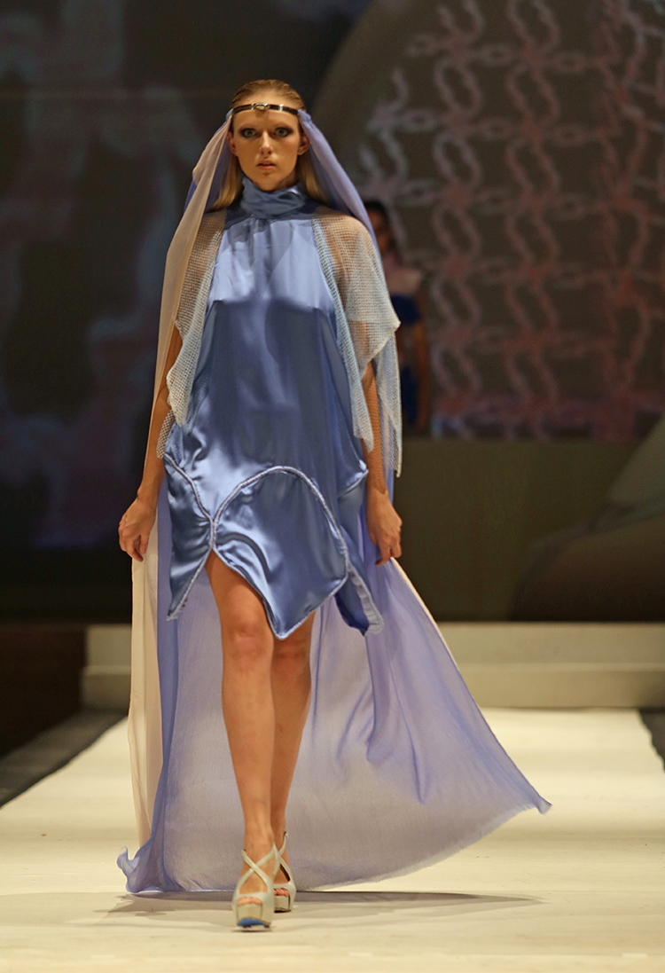 Syracuse University senior Lailee Waxman designed a dress shown at the SU Senior Collection Fashion Show at Goldstein Auditorium. The annual show presents the work of seniors in the College of Visual and Performing Arts fashion design program. Gloria Wright | Syracuse New Times