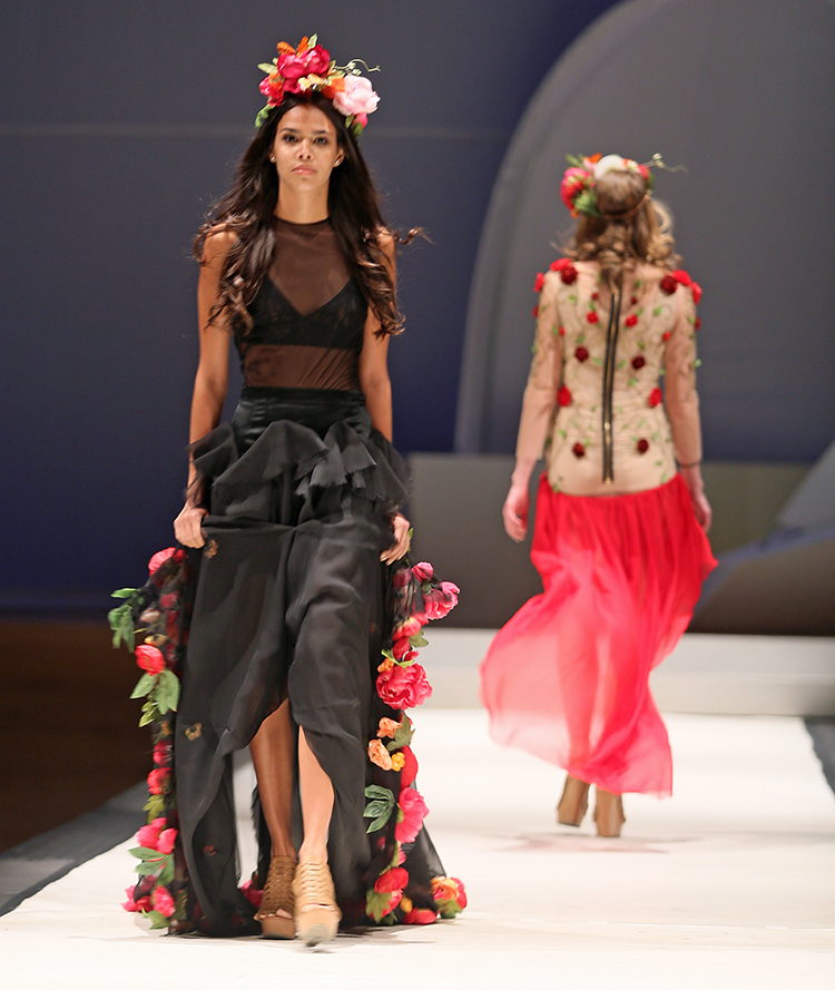 Syracuse University senior Amanda Martinez designed dresses shown at the SU Senior Collection Fashion Show at Goldstein Auditorium. The annual show presents the work of seniors in the College of Visual and Performing Arts fashion design program. Gloria Wright | Syracuse New Times