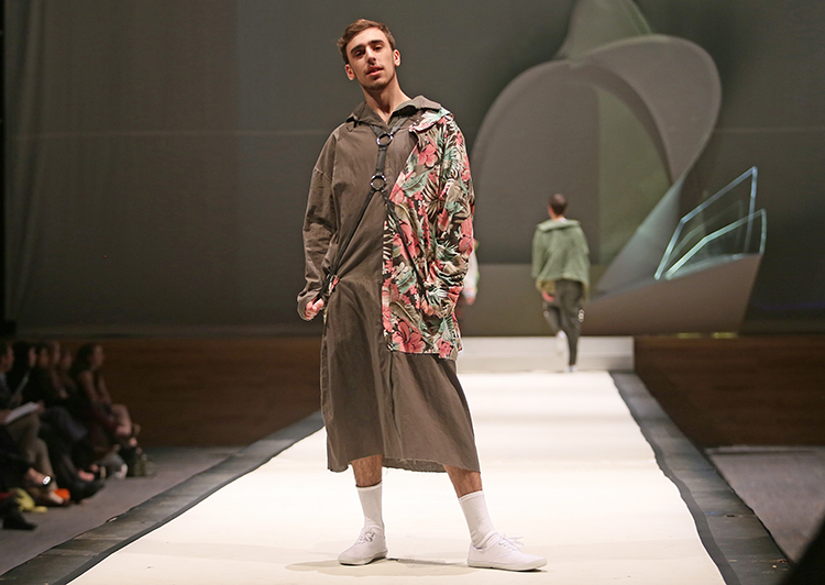 Syracuse University senior Sarabeth Fera designed an outfit shown at the SU Senior Collection Fashion Show at Goldstein Auditorium. The annual show presents the work of seniors in the College of Visual and Performing Arts fashion design program. Gloria Wright | Syracuse New Times