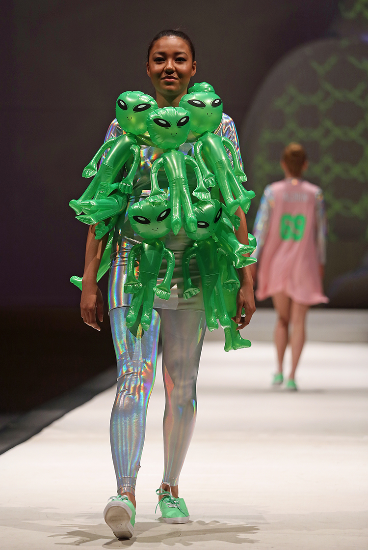 Syracuse University senior Emily Harrington designed an outfit shown at the SU Senior Collection Fashion Show at Goldstein Auditorium. The annual show presents the work of seniors in the College of Visual and Performing Arts fashion design program. Gloria Wright | Syracuse New Times