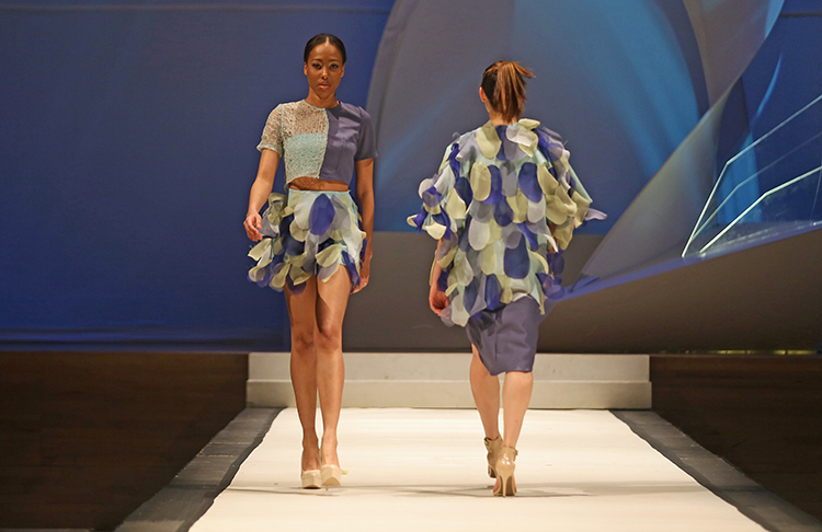 Syracuse University senior Rebecca Thibault designed dresses shown at the SU Senior Collection Fashion Show at Goldstein Auditorium. The annual show presents the work of seniors in the College of Visual and Performing Arts fashion design program. Gloria Wright | Syracuse New Times