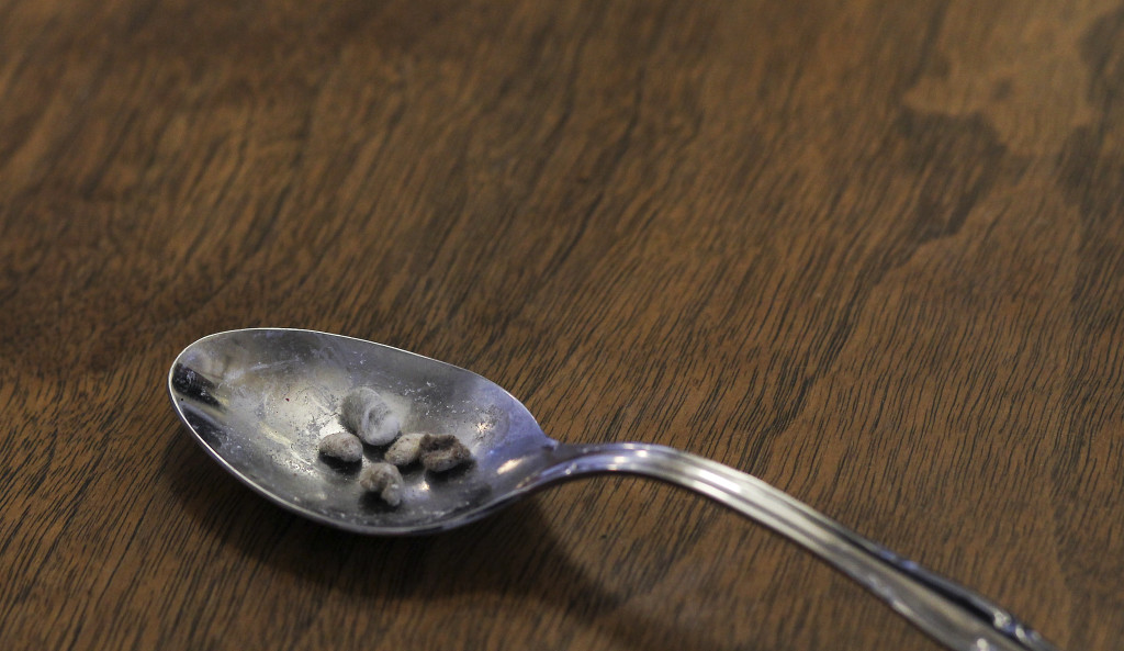 A confiscated heroin cook spoon with bits of balled cotton, displayed for a picture at the police station. The addict uses flames to melt heroin in the spoon and then uses cotton balls as filters when drawing the drug up into the syringe. Gov. Peter Shumlin devoted his entire state of the state address in January to what he called a "full-blown heroin crisis" in Vermont, where twice as many people died of heroin overdoses in 2012 as in the year before. Mr. Shumlin's address focused new attention on the problem, which has hit every corner of the state. Photo: Cheryl Senter for The New York Times