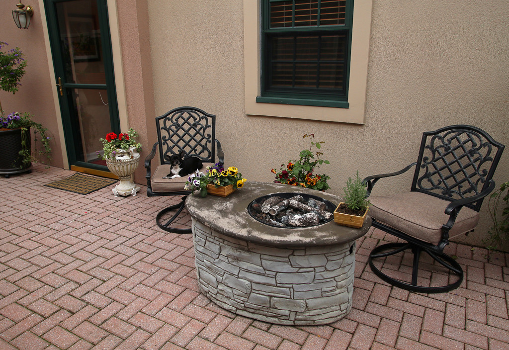 The homeowners have a propane-fueled firepit in the courtyard in front of the Center Armory home. Photo by Gloria Wright | Syracuse New Times.