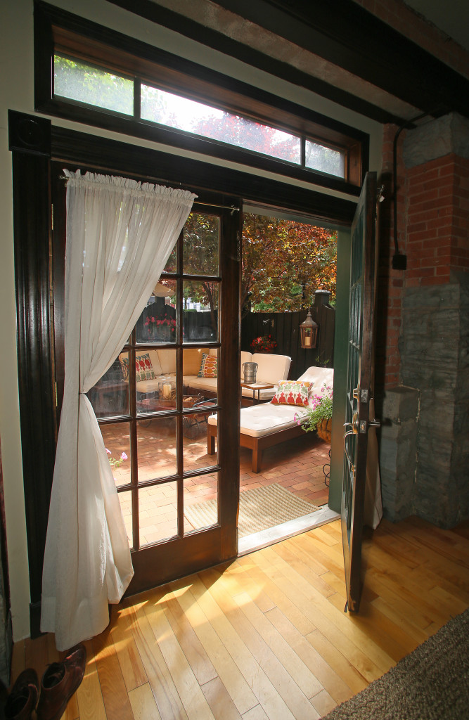 French doors in the dining room lead to a patio at Vinny Lobdell Jr.'s Mission Landing condominium. Photo by Gloria Wright | Syracuse New Times