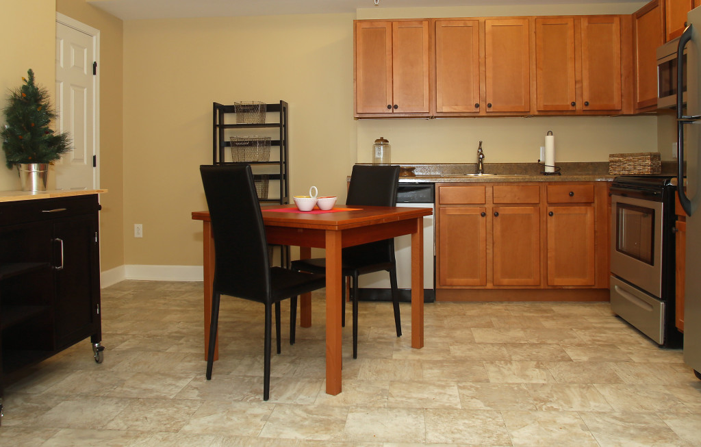 The kitchen in the model unit at 622 James St. has a tile floor and stainless steel appliances. Photo by Gloria Wright | Syracuse New Times