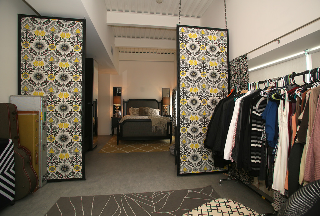 Catherine and Stephen Wolfe used fabric screens to create a walk-in closet in their fourth-floor apartment in the former Lincoln Supply warehouse on the near west side. Photo by Gloria Wright | Syracuse New Times