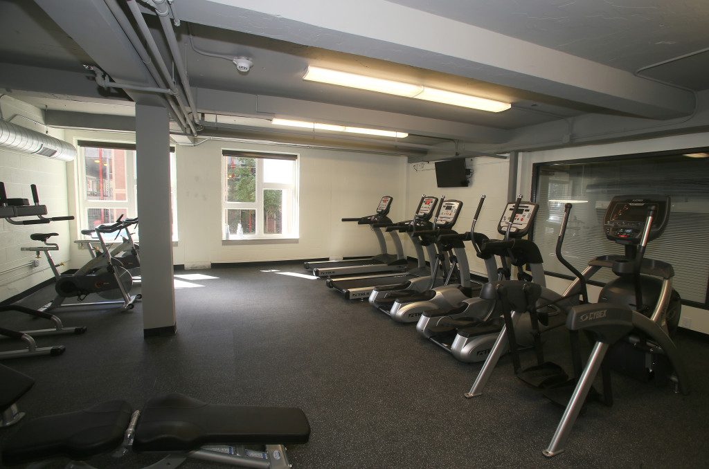 The amenities at Creekwalk Commons include a work-out room, a theater and work spaces for students. Photo by Gloria Wright | Syracuse New Times