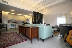 Stephen Wolfe's recent purchase of a stereo console backs up to the sofa in the former Lincoln Supply building on the city's near west side. Photo by Gloria Wright | Syracuse New Times