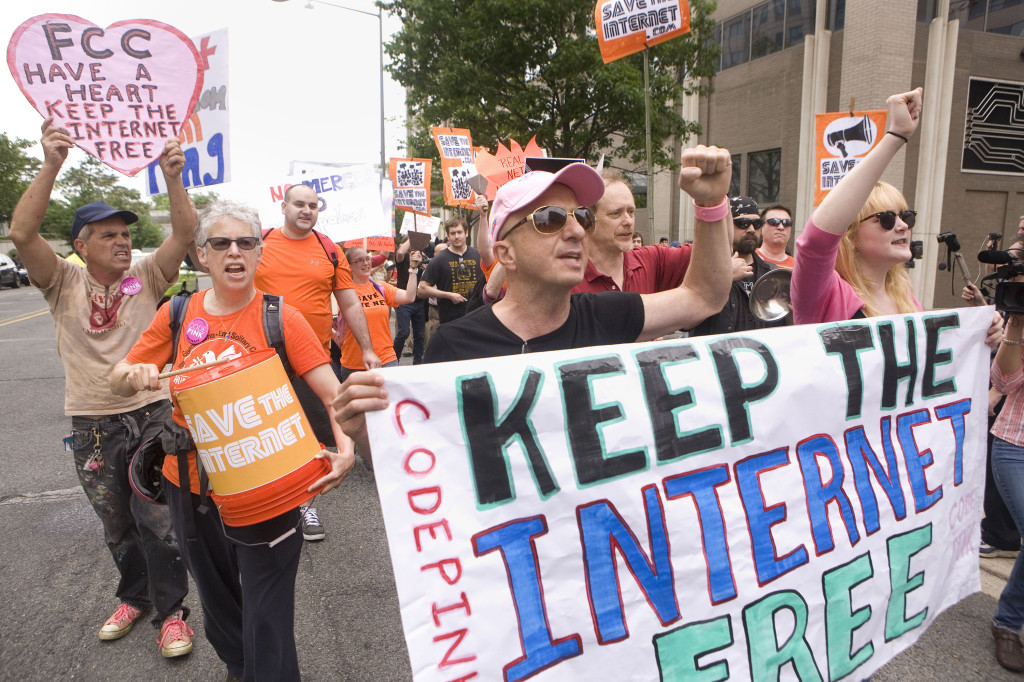 Before the Open Commission Meeting to vote on net neutrality was held at the FCC headquarters in Washington DC, protestors marched out front. Photo Credit: Daniel Rosenbaum for The New York Times.