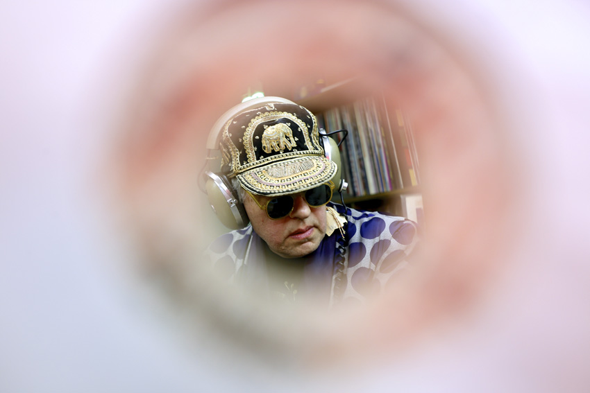 Mixmaster Broda and his Record Collection - Through the hole in a 45 single. Michael Davis Photo | Syracuse New Times