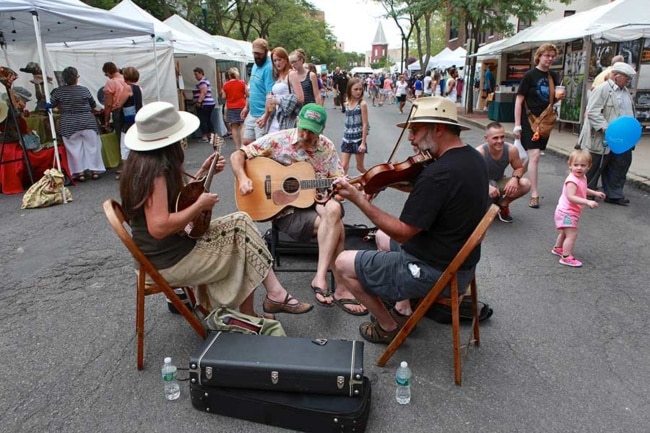 The quintessential mix of musicians and artisans at the AmeriCU Syracuse Arts & Crafts Festival. Michael Davis photo